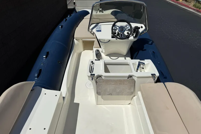 Slide: The Image of 2021 Zodiac N-ZO 680 boat interior with steering console and seating. - 10