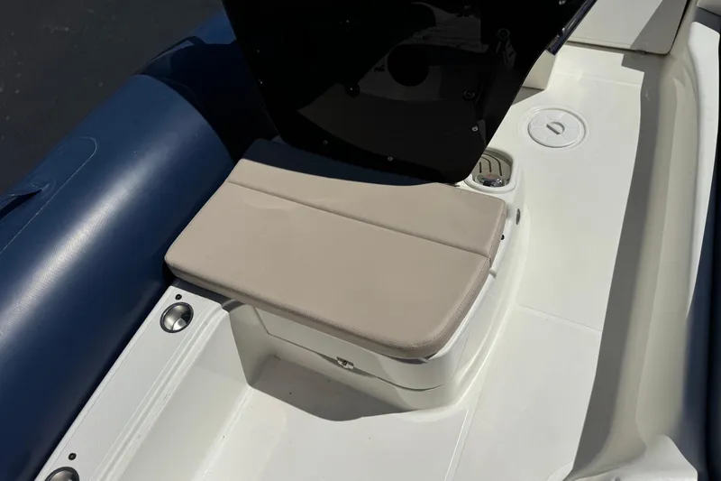Slide: The Image of 2021 Zodiac N-ZO 680 boat interior with cushioned seating and cup holders. - 15