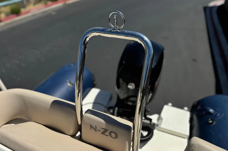 Slide: The Image of 2021 Zodiac N-ZO 680 boat interior with chrome details and cushioned seating. - 19