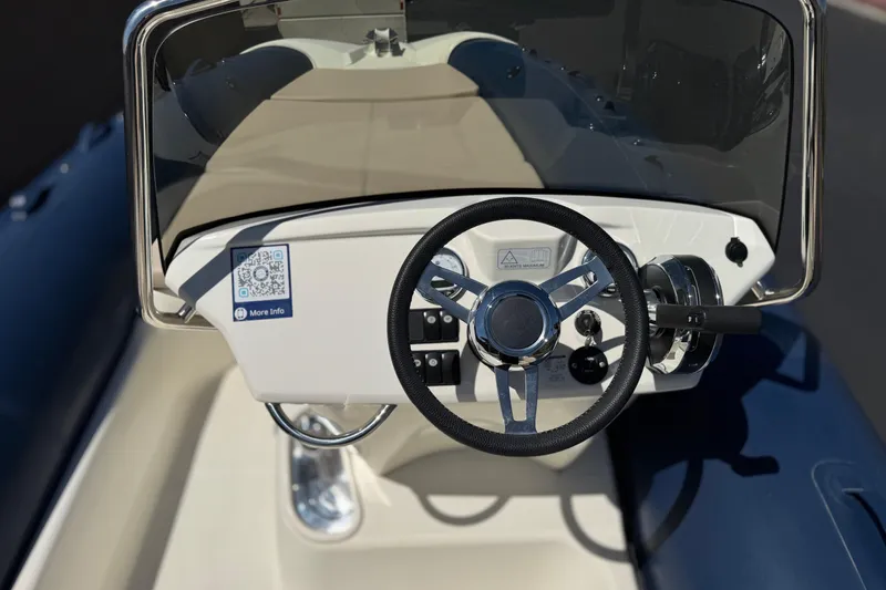 Slide: The Image of Steering console of 2021 Zodiac N-ZO 680 boat with QR code and controls. - 22