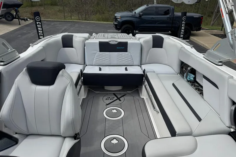 Slide: The Image of 2021 MasterCraft X22 boat interior with luxurious seating and modern design. - 11