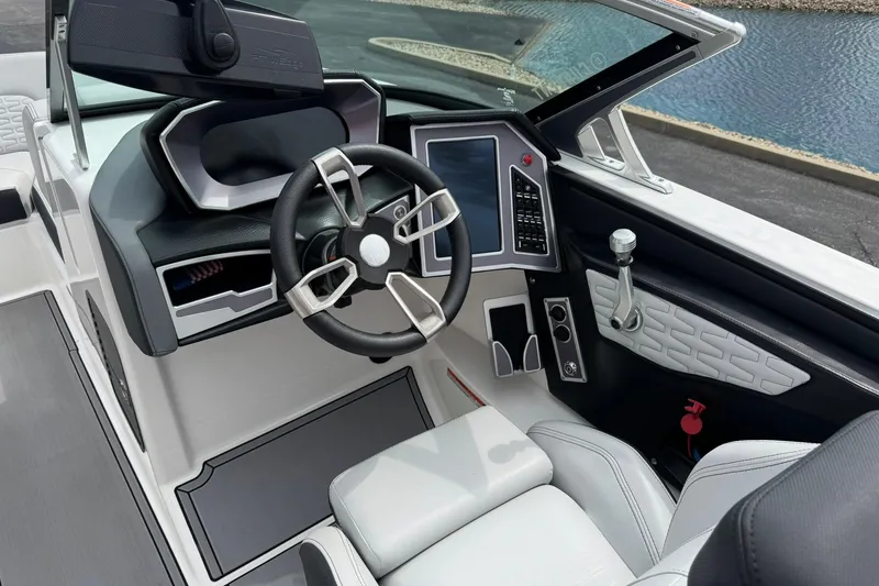 Slide: The Image of 2021 MasterCraft X22 boat interior with modern steering and control panel. - 9