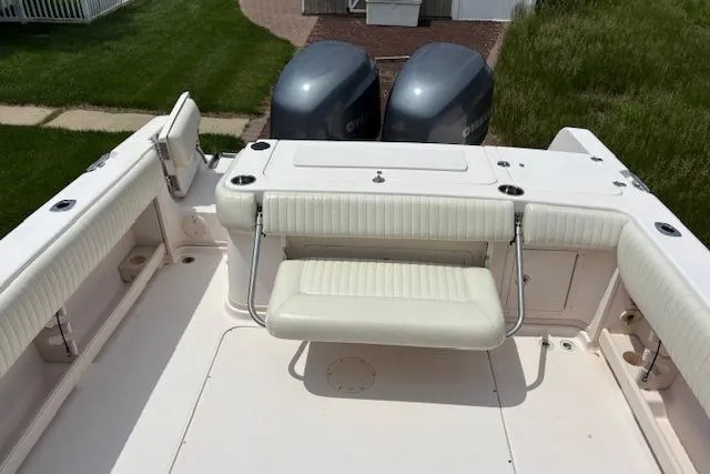 Slide: The Image of 2005 Grady White 282 Sailfish boat with twin engines and cushioned seating. - 7