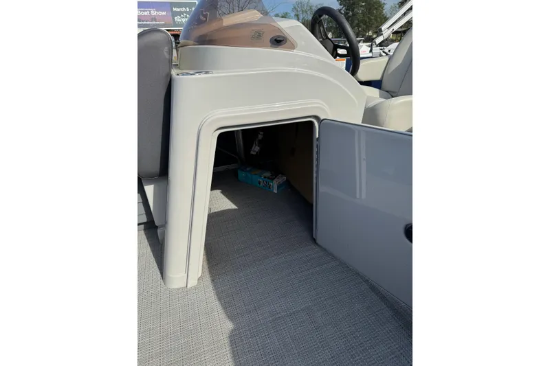 Slide: The Image of 2023 Sylvan Mirage 820 Cruise boat interior storage compartment open. - 11