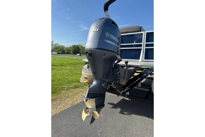 Slide: The Image of 2023 Sylvan Mirage 820 Cruise with Yamaha 90 outboard motor on a sunny day. - 3