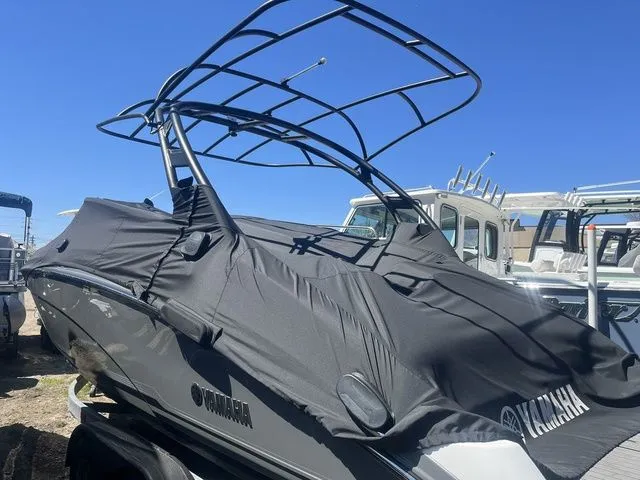 Slide: The Image of 2019 Yamaha Boats 242 Limited S with cover outdoors. - 3