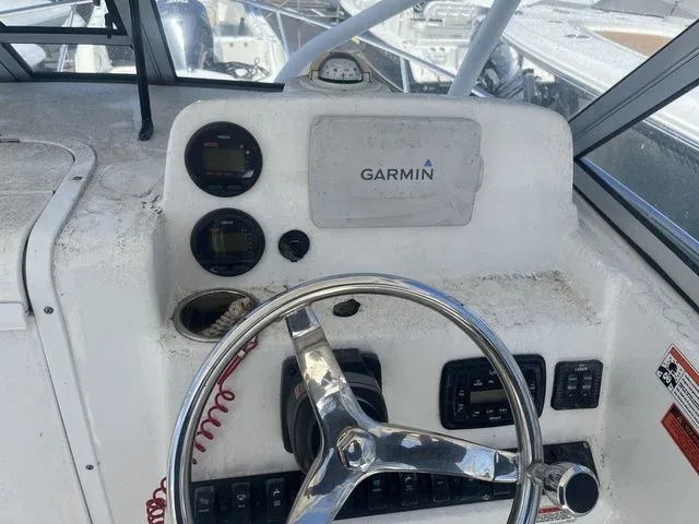 Slide: The Image of 2014 Sea Hunt Victory 225 boat helm with Garmin device. - 5
