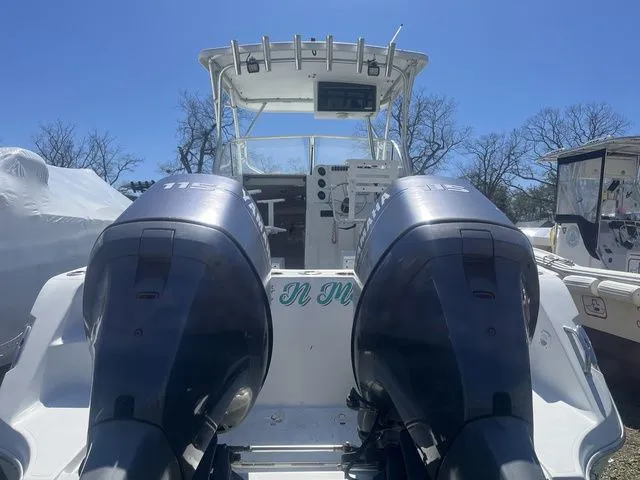 Slide: The Image of Rear view of a 2006 Polar 2300 WA boat with twin outboard engines. - 6