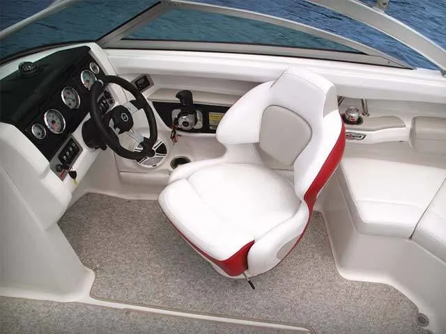 Slide: The Image of Interior of a 2011 Chaparral 216 SSi boat with white and red seating. - 6