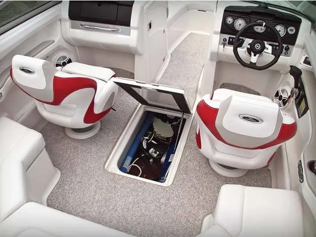 Slide: The Image of Interior of a 2011 Chaparral 216 SSi boat with red seats. - 9