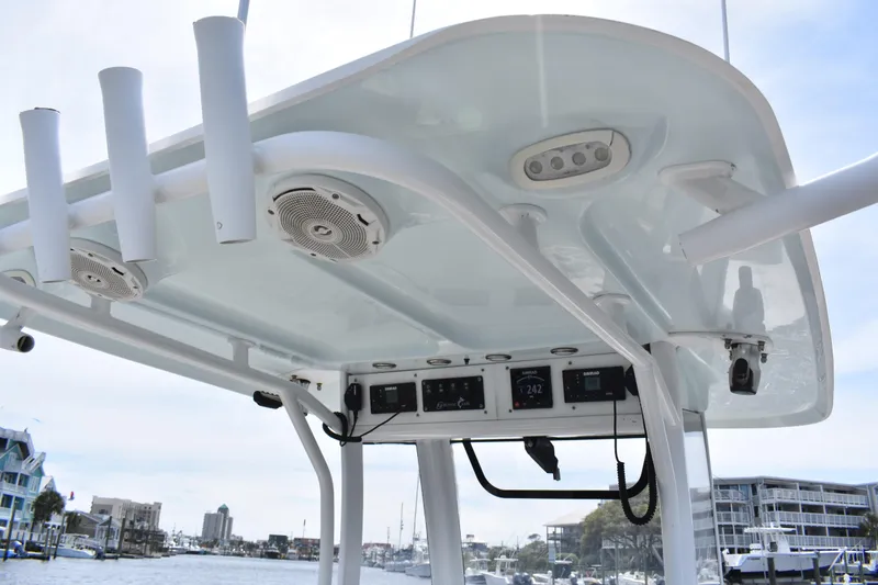 Slide: The Image of 2017 Sea Hunt Gamefish 27 boat console with speakers and rod holders. - 12