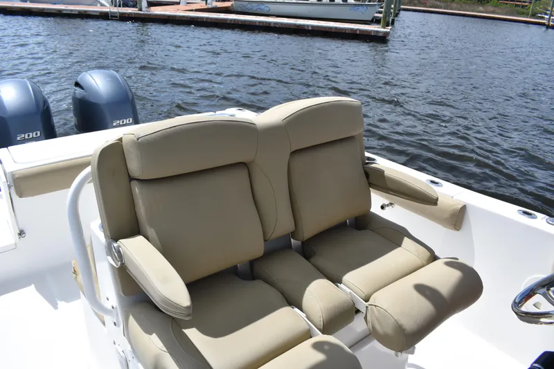 Slide: The Image of 2017 Sea Hunt Gamefish 27 boat with dual seating and twin 200 engines on water. - 18