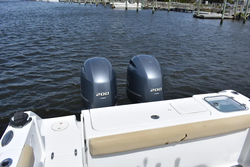 Slide: The Image of 2017 Sea Hunt Gamefish 27 with twin Yamaha 200 engines on calm water. - 20