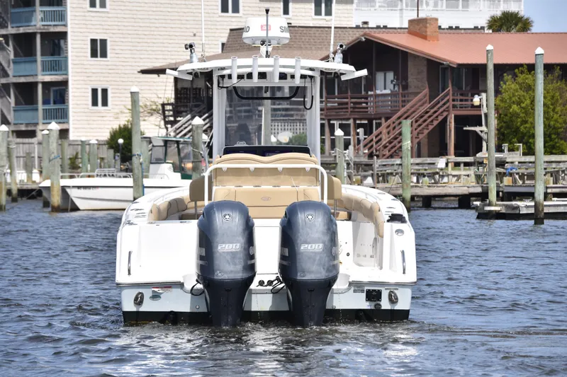 Slide: The Image of 2017 Sea Hunt Gamefish 27 boat with dual engines docked in marina. - 7