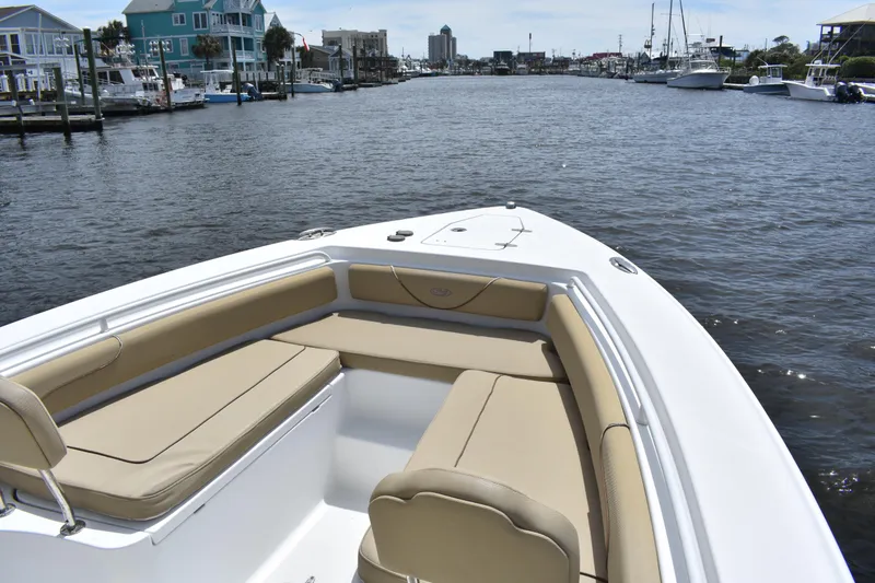 Slide: The Image of 2017 Sea Hunt Gamefish 27 boat with forward seating on a calm waterway. - 8