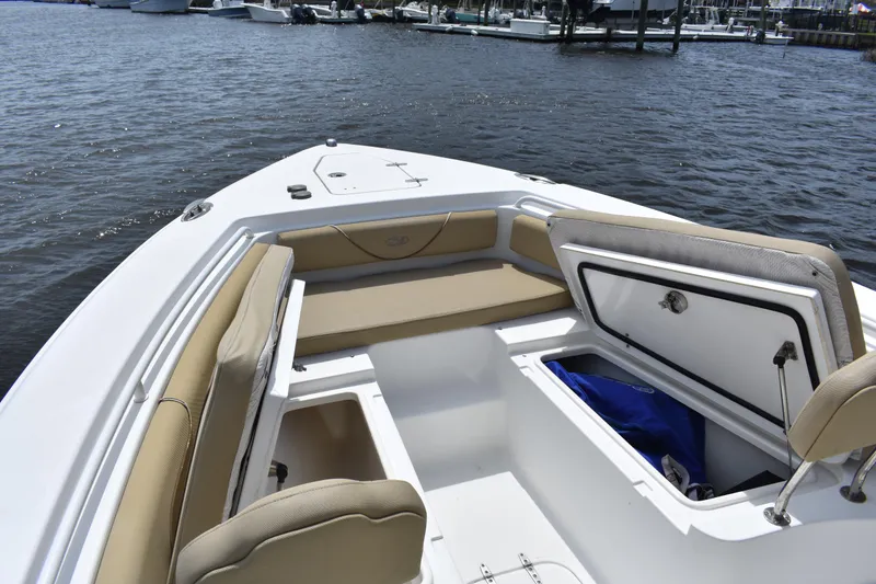 Slide: The Image of 2017 Sea Hunt Gamefish 27 boat with forward seating and storage compartments. - 9