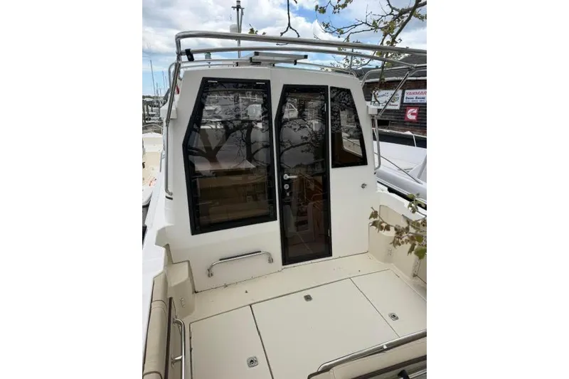 Slide: The Image of 2020 Ranger Tugs R-23 boat with rear deck and glass doors. - 11
