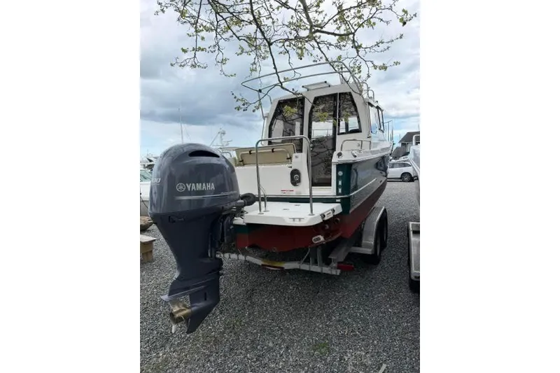 Slide: The Image of 2020 Ranger Tugs R-23 boat with Yamaha outboard motor on a trailer. - 5