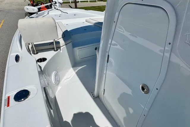 Slide: The Image of 2022 Sea Hunt BX 25 FS boat interior, featuring seating and storage compartments. - 12