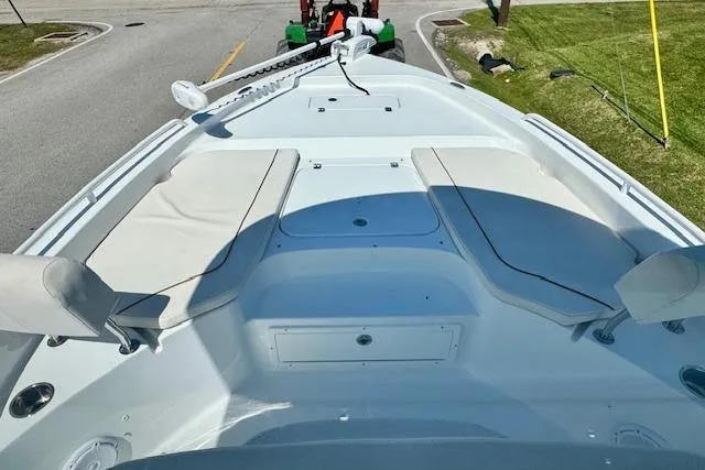 Slide: The Image of 2022 Sea Hunt BX 25 FS boat deck with seating and storage compartments. - 14
