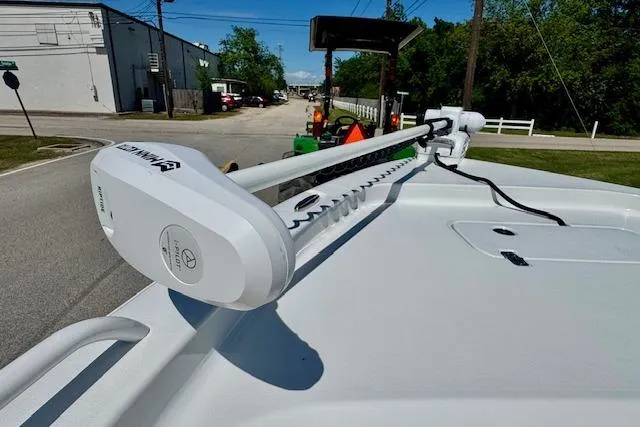 Slide: The Image of 2022 Sea Hunt BX 25 FS boat with a mounted trolling motor on the deck. - 18