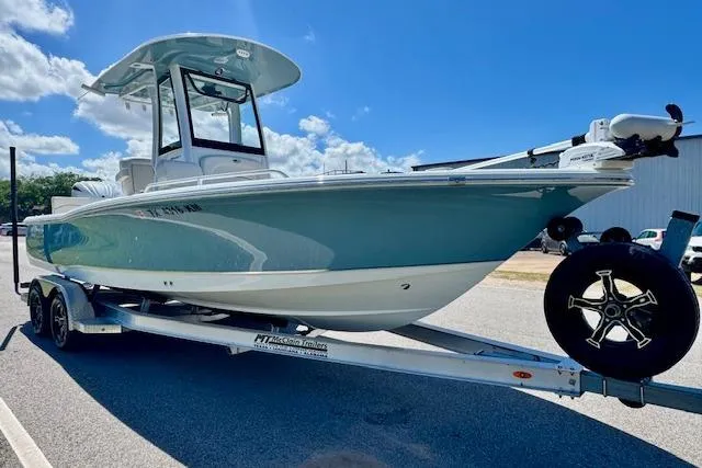 Slide: The Image of 2022 Sea Hunt BX 25 FS boat on trailer under clear blue sky. - 5