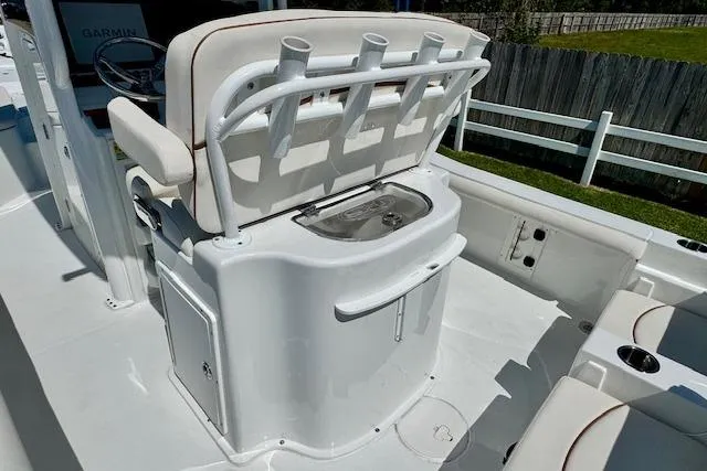 Slide: The Image of 2022 Sea Hunt BX 25 FS boat interior with rod holders and seating. - 8