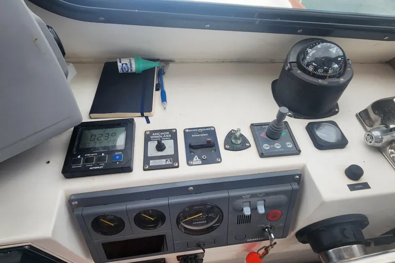 Slide: The Image of Control panel of a 2001 Eastern 31 Casco Bay boat with navigation instruments. - 10