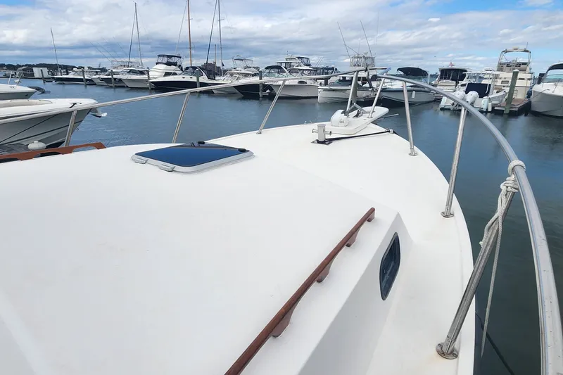 Slide: The Image of 2001 Eastern 31 Casco Bay boat docked among other vessels in a marina. - 3