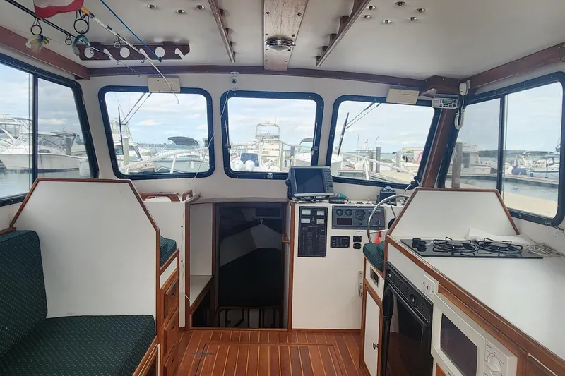 Slide: The Image of Interior of a 2001 Eastern 31 Casco Bay boat with helm and galley. - 7