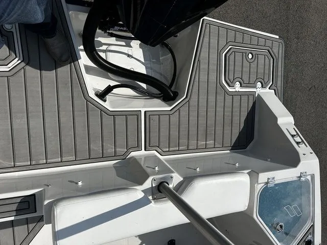 Slide: The Image of Starcraft SVX 231 OB boat deck with gray flooring, 2024 model. - 18