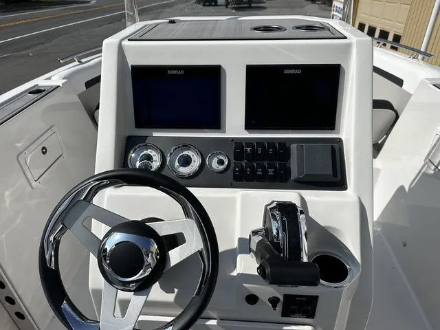 Slide: The Image of Control console of the 2024 Starcraft SVX 231 OB boat. - 19