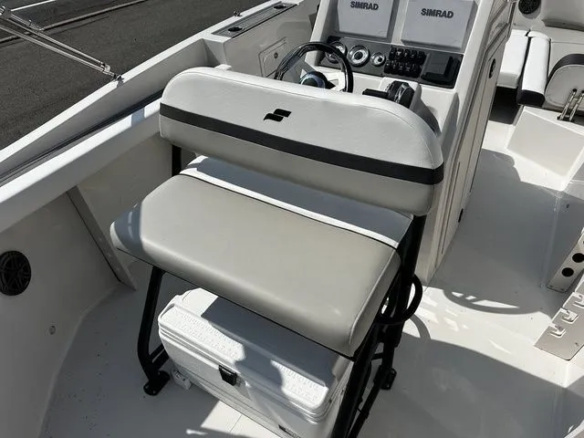 Slide: The Image of Interior of a 2024 Starcraft SVX 231 OB boat with helm console. - 25