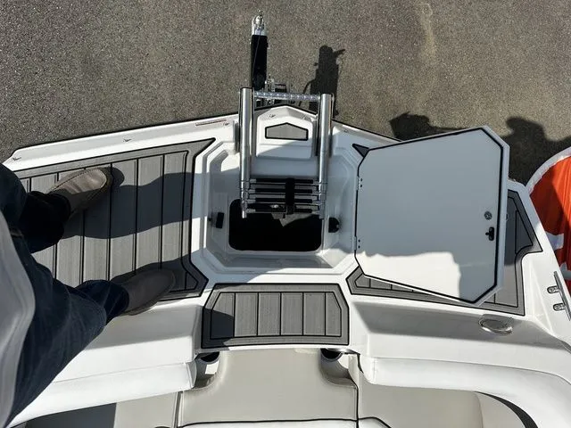 Slide: The Image of Top view of 2024 Starcraft SVX 231 OB boat with open hatch. - 29