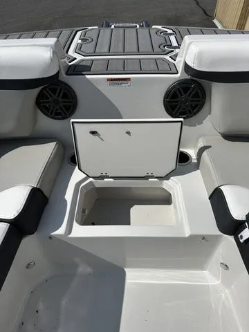 Slide: The Image of 2024 Starcraft SVX 231 OB boat with open storage and speakers. - 32