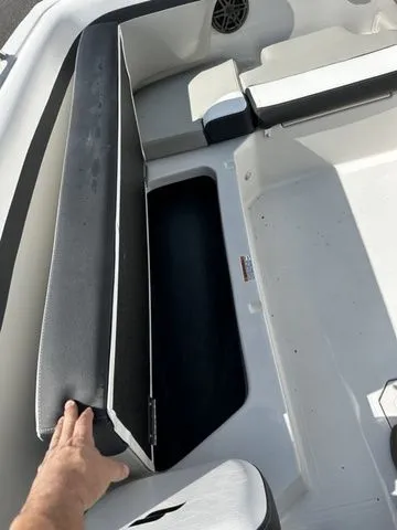 Slide: The Image of 2024 Starcraft SVX 231 OB boat with seating and storage compartment. - 33