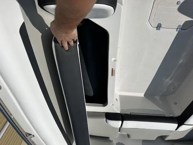 Slide: The Image of Starcraft SVX 231 OB boat with storage compartment open, 2024 model. - 34