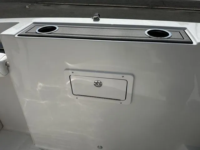 Slide: The Image of 2024 Starcraft SVX 231 OB boat with cup holders and storage. - 36