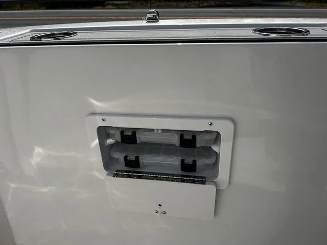 Slide: The Image of Starcraft SVX 231 OB 2024 boat with storage compartment and cup holders. - 37