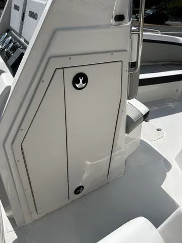 Slide: The Image of 2024 Starcraft SVX 231 OB boat interior with helm console. - 41
