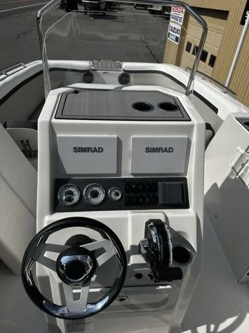 Slide: The Image of 2024 Starcraft SVX 231 boat console with Simrad controls. - 43
