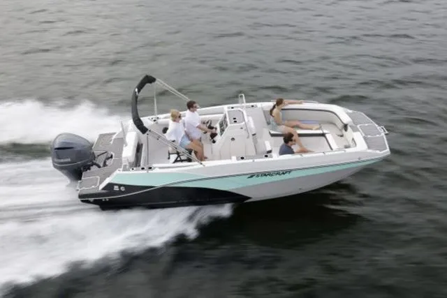 Slide: The Image of 2024 Starcraft SVX 231 OB boat on water with passengers. - 7