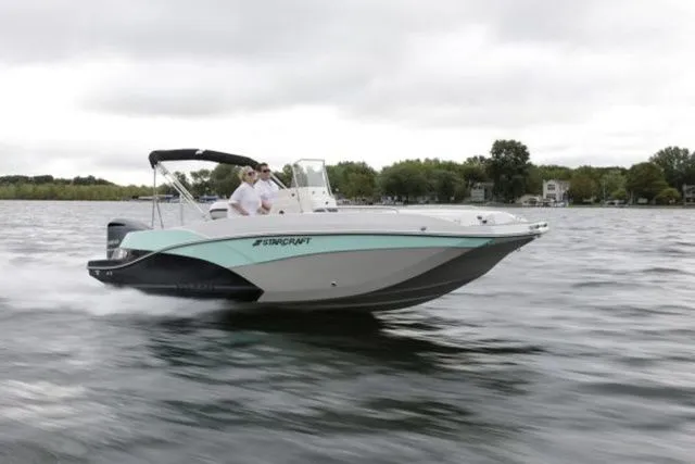 Slide: The Image of 2024 Starcraft SVX 231 OB boat cruising on water. - 8