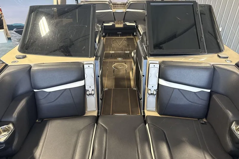 Slide: The Image of Interior of 2023 Supra SE 550 boat with luxurious seating and sleek design. - 12