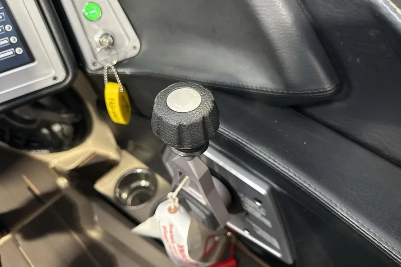 Slide: The Image of 2023 Supra SE 550 boat control panel with throttle lever and key ignition. - 17