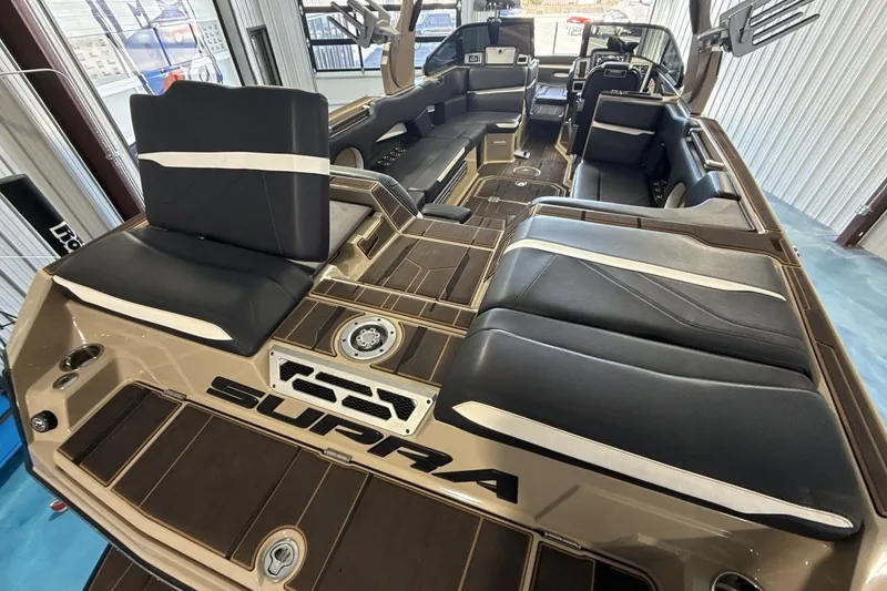 Slide: The Image of 2023 Supra SE 550 boat interior with luxurious seating and modern design. - 19