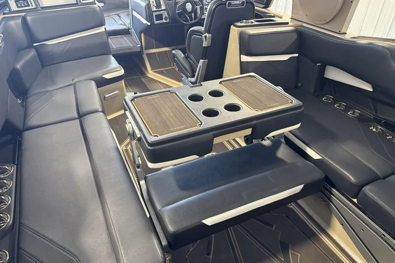 Slide: The Image of Luxurious interior of 2023 Supra SE 550 boat with plush seating and cup holders. - 23