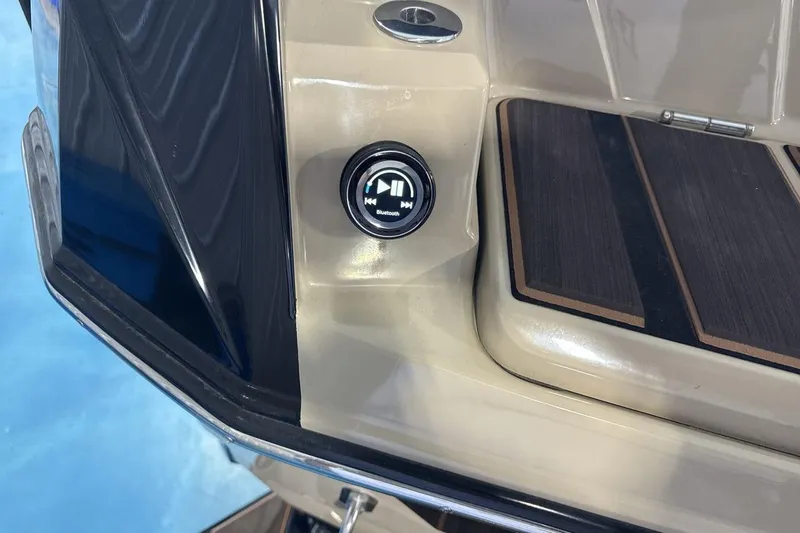 Slide: The Image of 2023 Supra SE 550 boat with Bluetooth control on deck. - 27