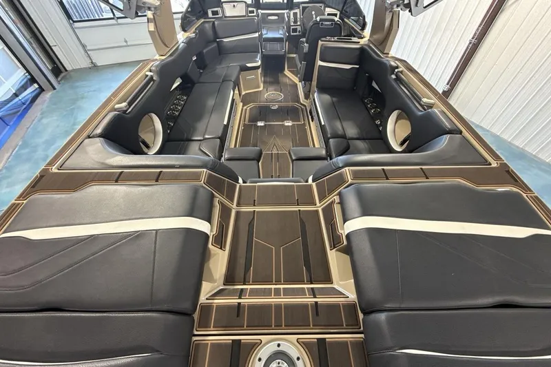 Slide: The Image of Luxurious interior of 2023 Supra SE 550 boat with sleek black seating and modern design. - 9