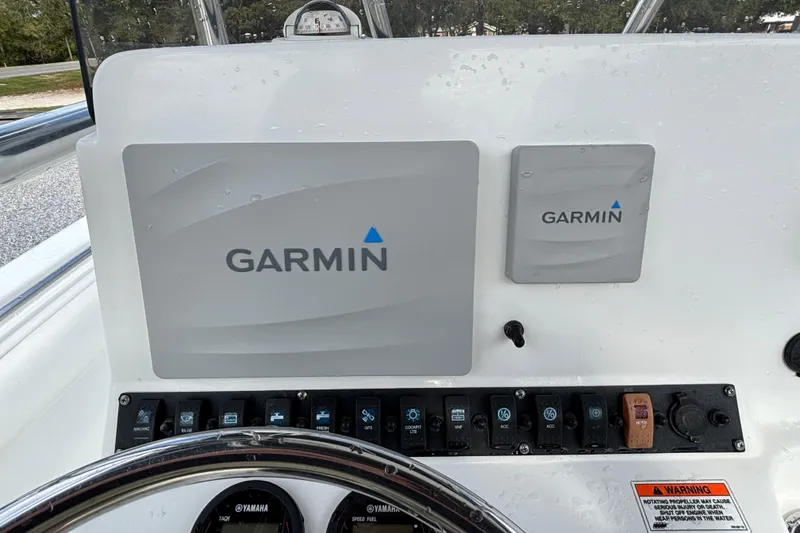Slide: The Image of Garmin navigation system on 2016 Sea Hunt Ultra 225 boat dashboard. - 13